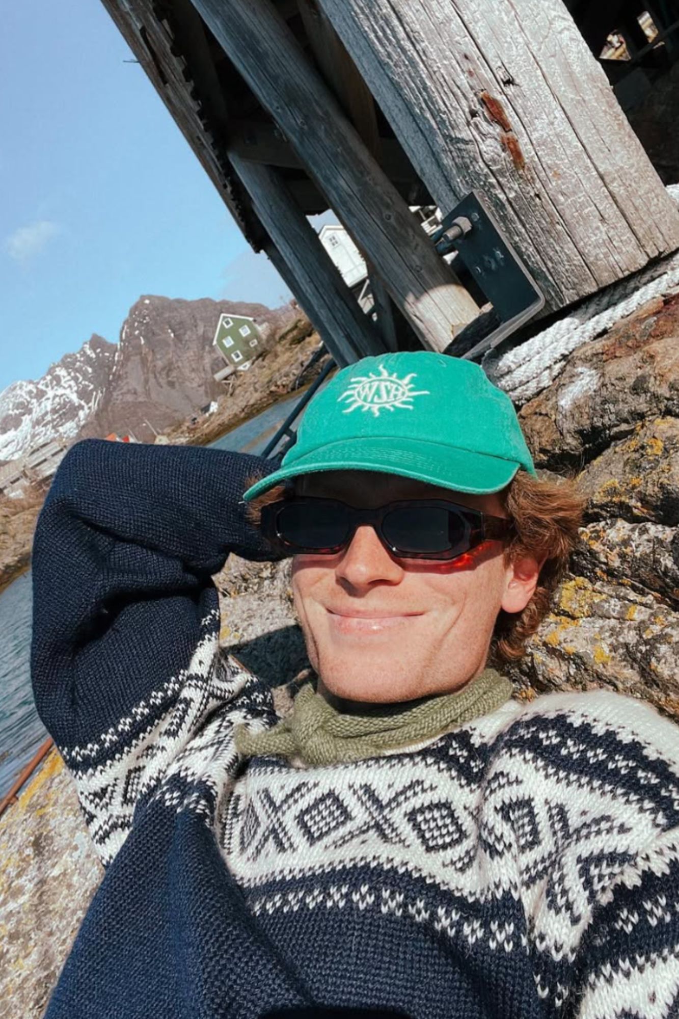 Ådne Birkeland smiling with a blue cortina sweater from Dale of Norway and a caps