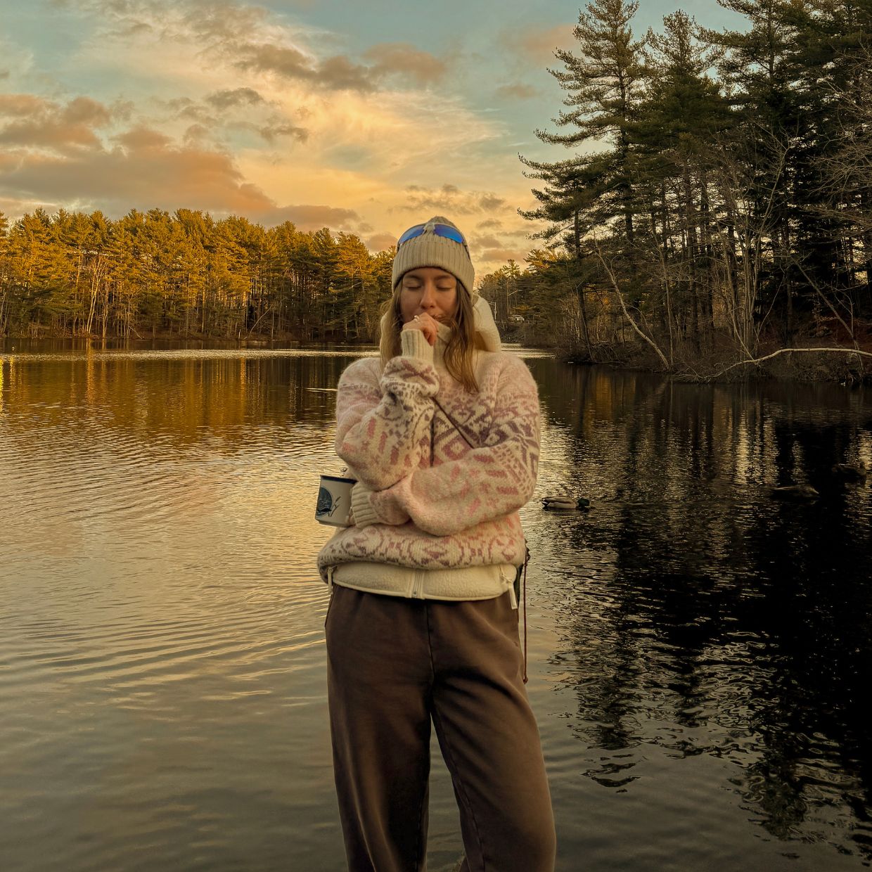 Female influencer from Canada wearing a pink knitted sweater from Dale of Norway in nature