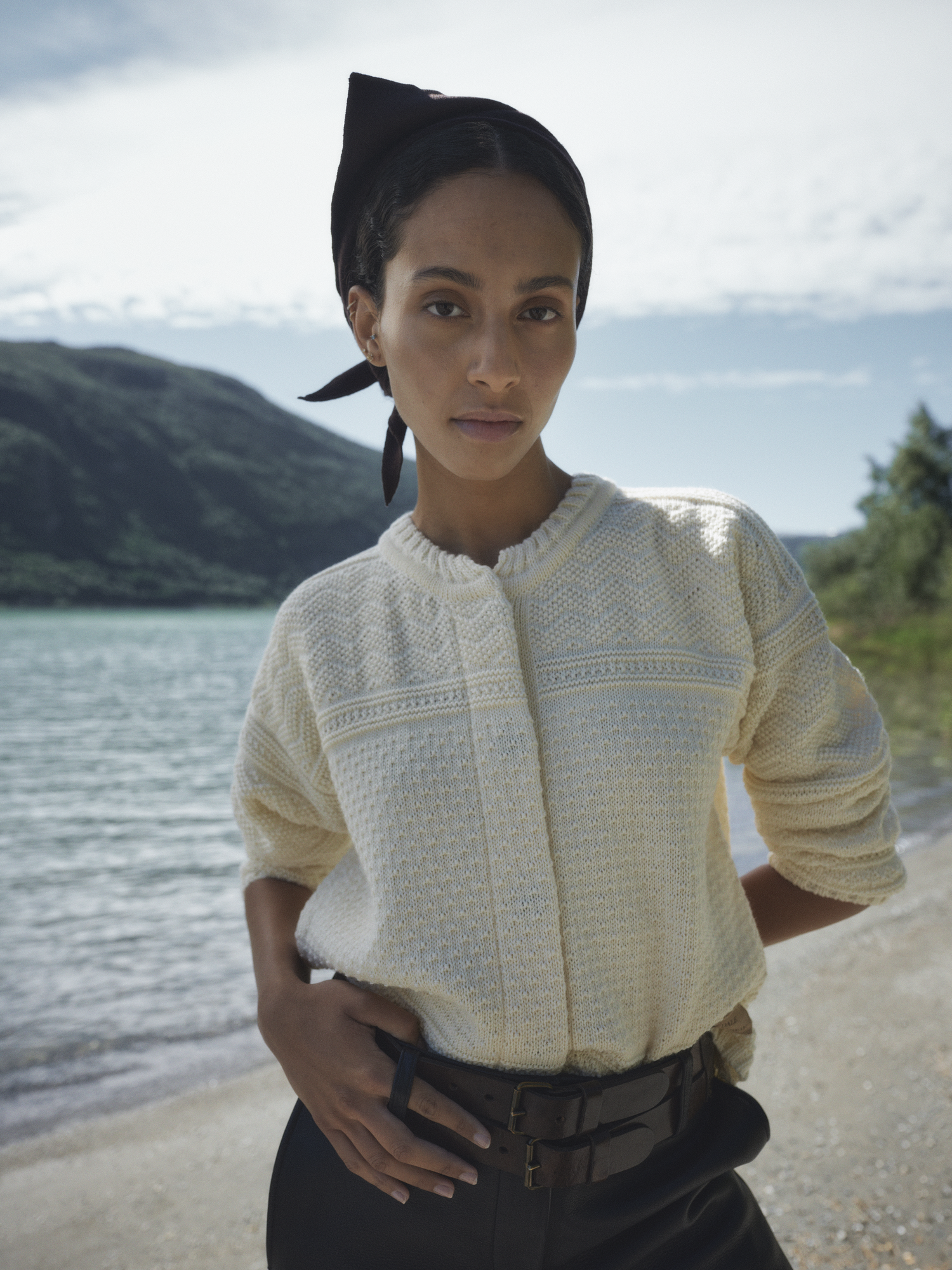 Female model wearing Lusa Cardigan from Dale of Norway in beautiful nature surroundings from Norway
