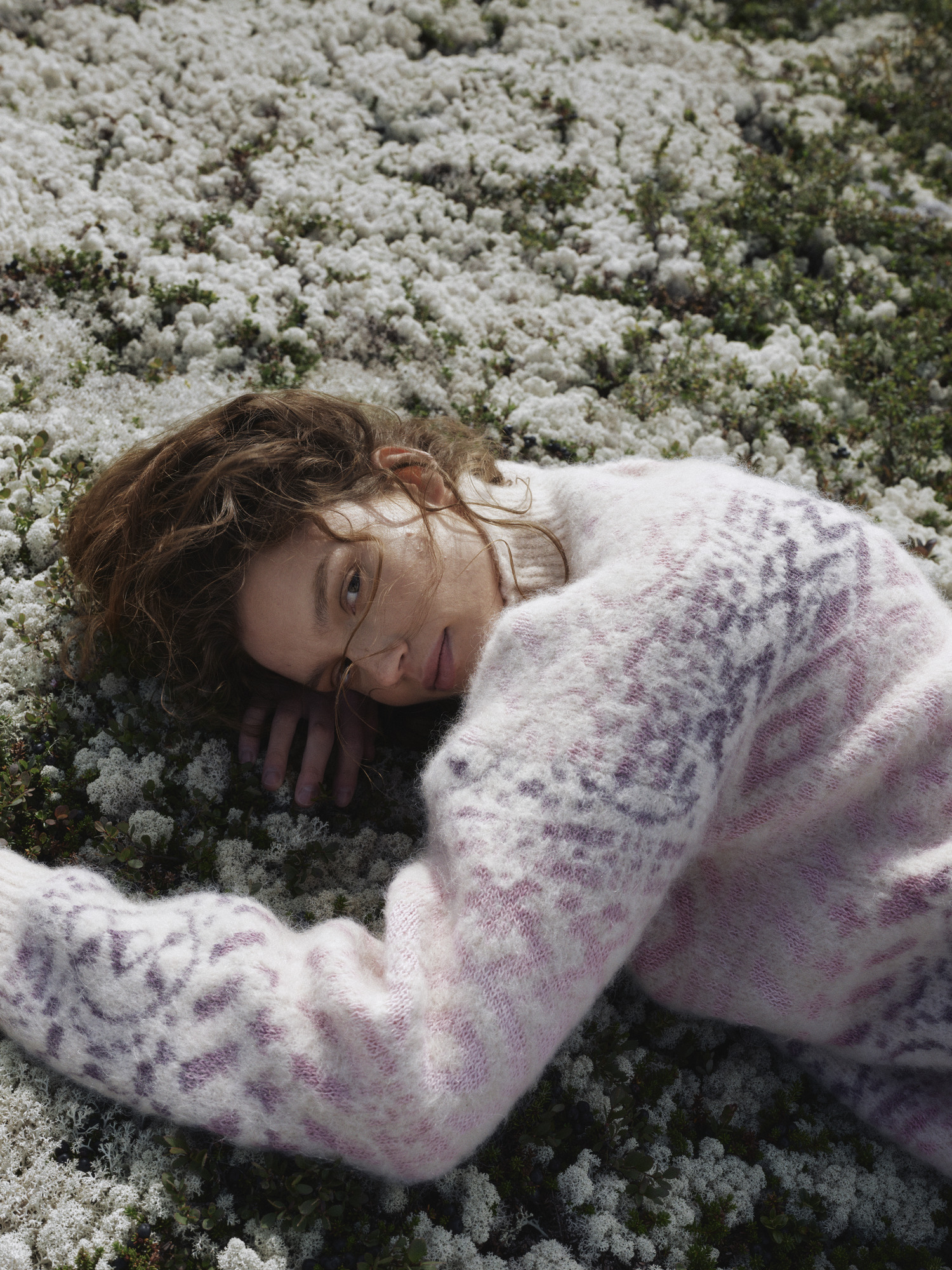 Female model wearing pink Highland sweater from Dale of Norway